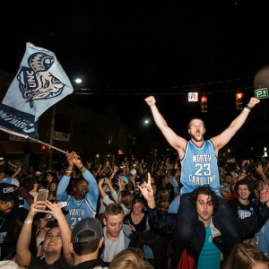 Photo of students rushing Franklin street after a Carolina victory