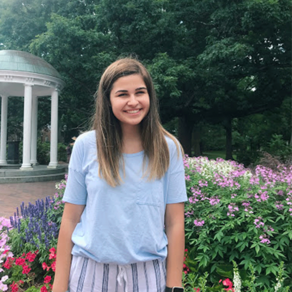 Photo of first-year Alyssa Floyd next to the Old Well