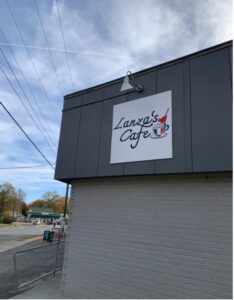 Lanza's Cafe sign on the side of a building