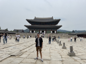 Amir standing in front of a large South Korean temple.