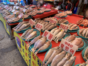 South Korean fish market. The fish are laid nicely on a table.